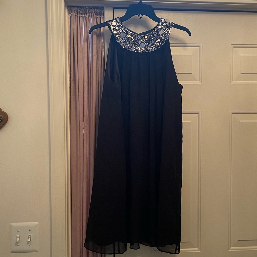 Cute little black dress with sequined neckline